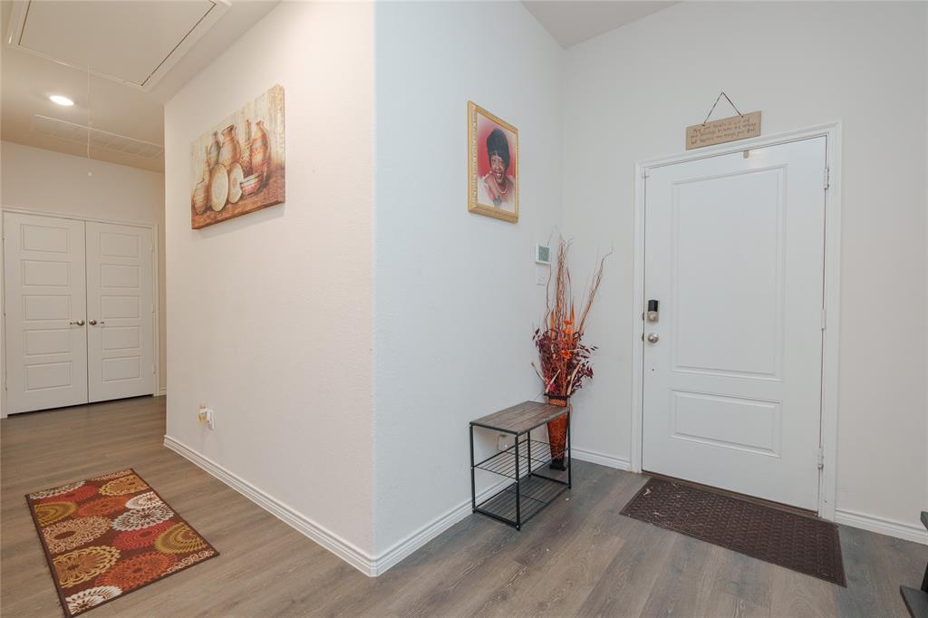 4009 Forest Bend Road Denton, TX 76208 - Photo 19 of 35 Entryway featuring wood finished floors and baseboards