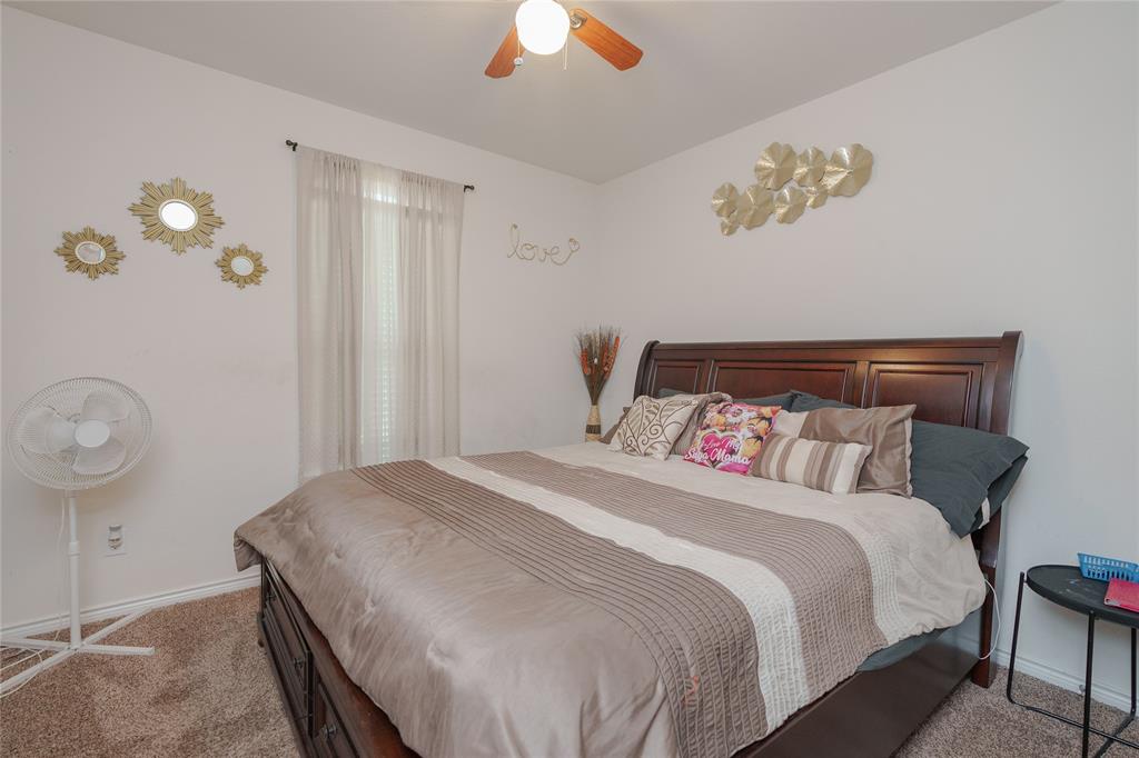 4009 Forest Bend Road Denton, TX 76208 - Photo 20 of 35 Carpeted bedroom with baseboards and a ceiling fan