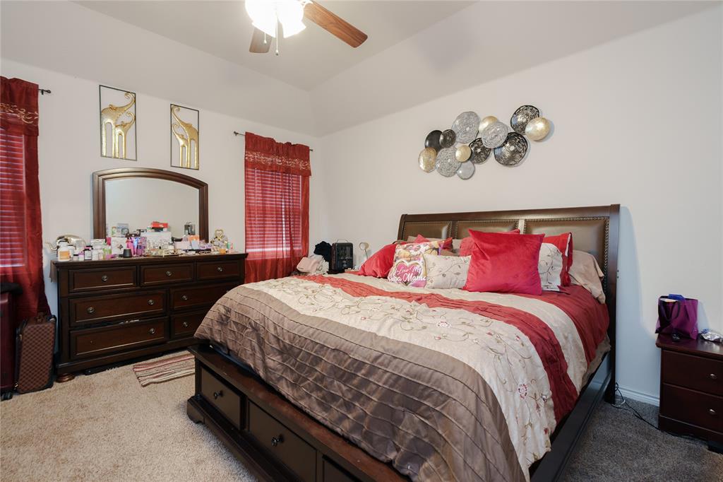 4009 Forest Bend Road Denton, TX 76208 - Photo 24 of 35 Carpeted bedroom featuring a ceiling fan and lofted ceiling