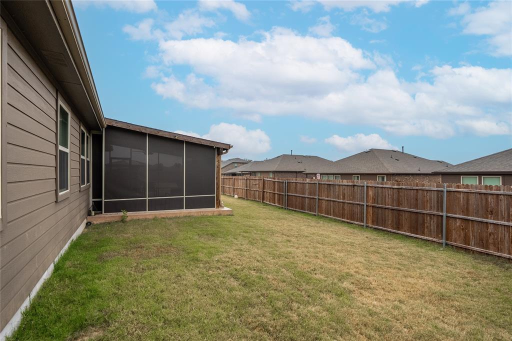 4009 Forest Bend Road Denton, TX 76208 - Photo 31 of 35 Fenced backyard featuring a sunroom and a residential view