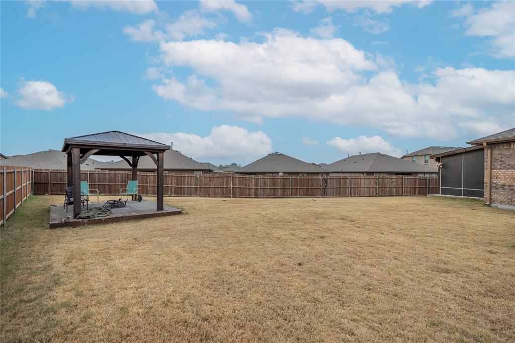 4009 Forest Bend Road Denton, TX 76208 - Photo 33 of 35 Fenced backyard featuring a gazebo