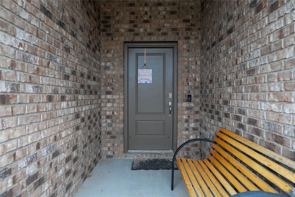 4009 Forest Bend Road Denton, TX 76208 - Photo 5 of 35 Entrance to property featuring brick siding