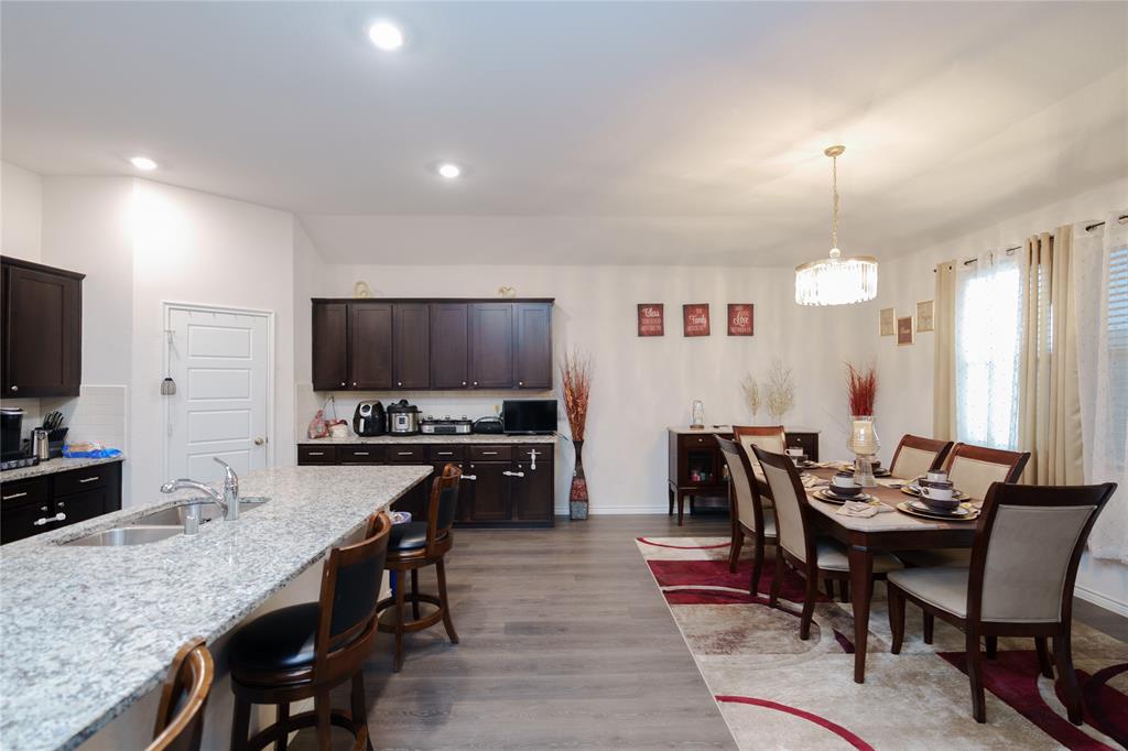 4009 Forest Bend Road Denton, TX 76208 - Photo 7 of 35 Dining room with dark wood finished floors and baseboards