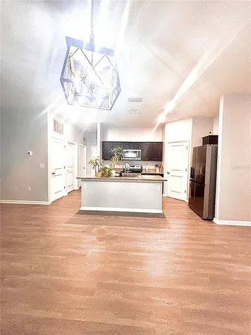 a bathroom with a toilet and a shower curtain