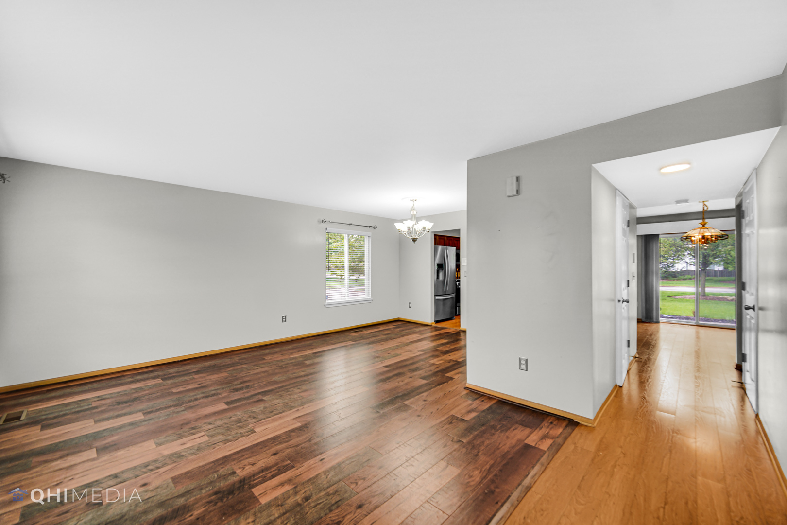 21432 Georgetown Drive Plainfield, IL 60544 - Photo 11 of 24 an empty room with wooden floor and windows