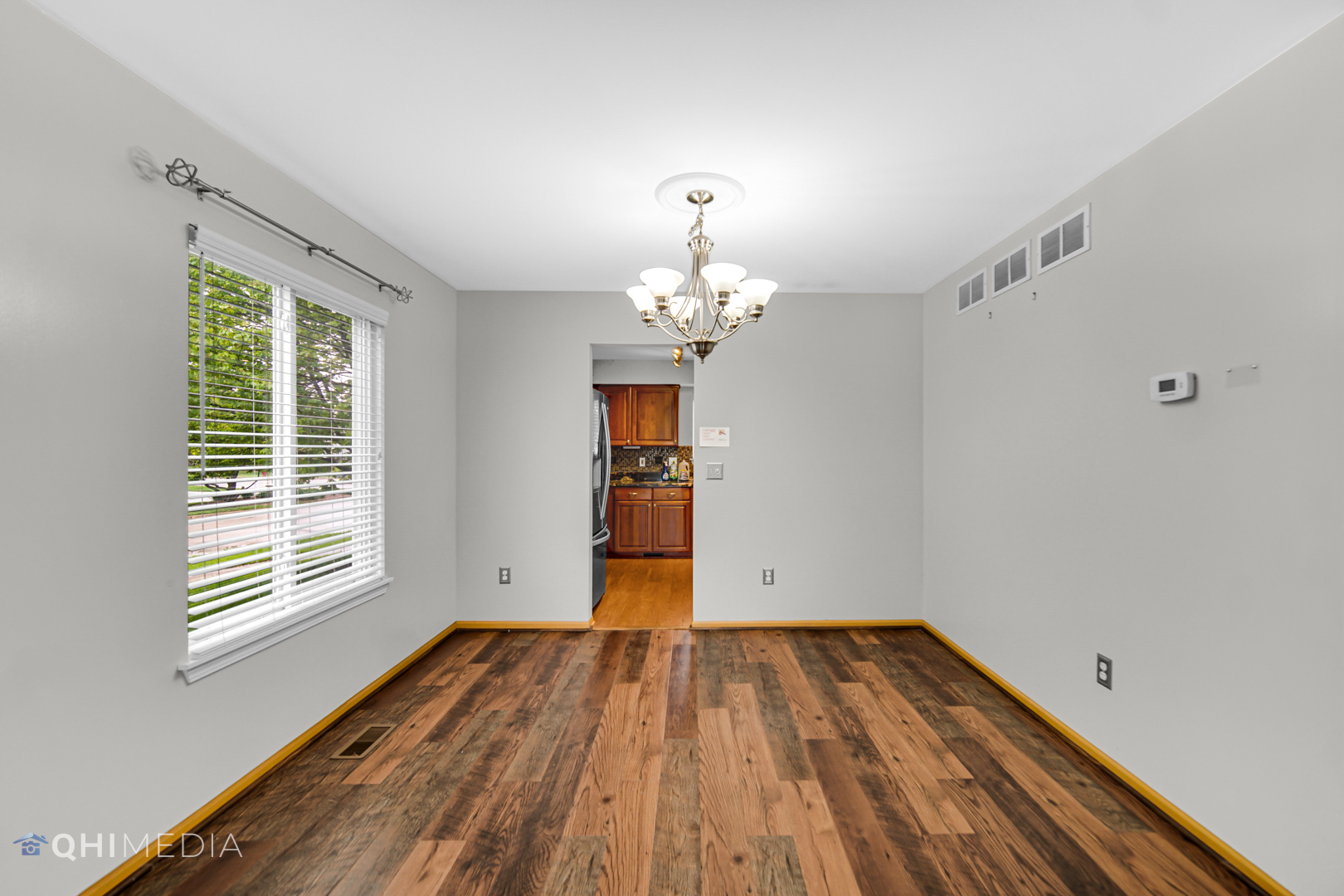 21432 Georgetown Drive Plainfield, IL 60544 - Photo 18 of 24 a view of a room with wooden floor and a window