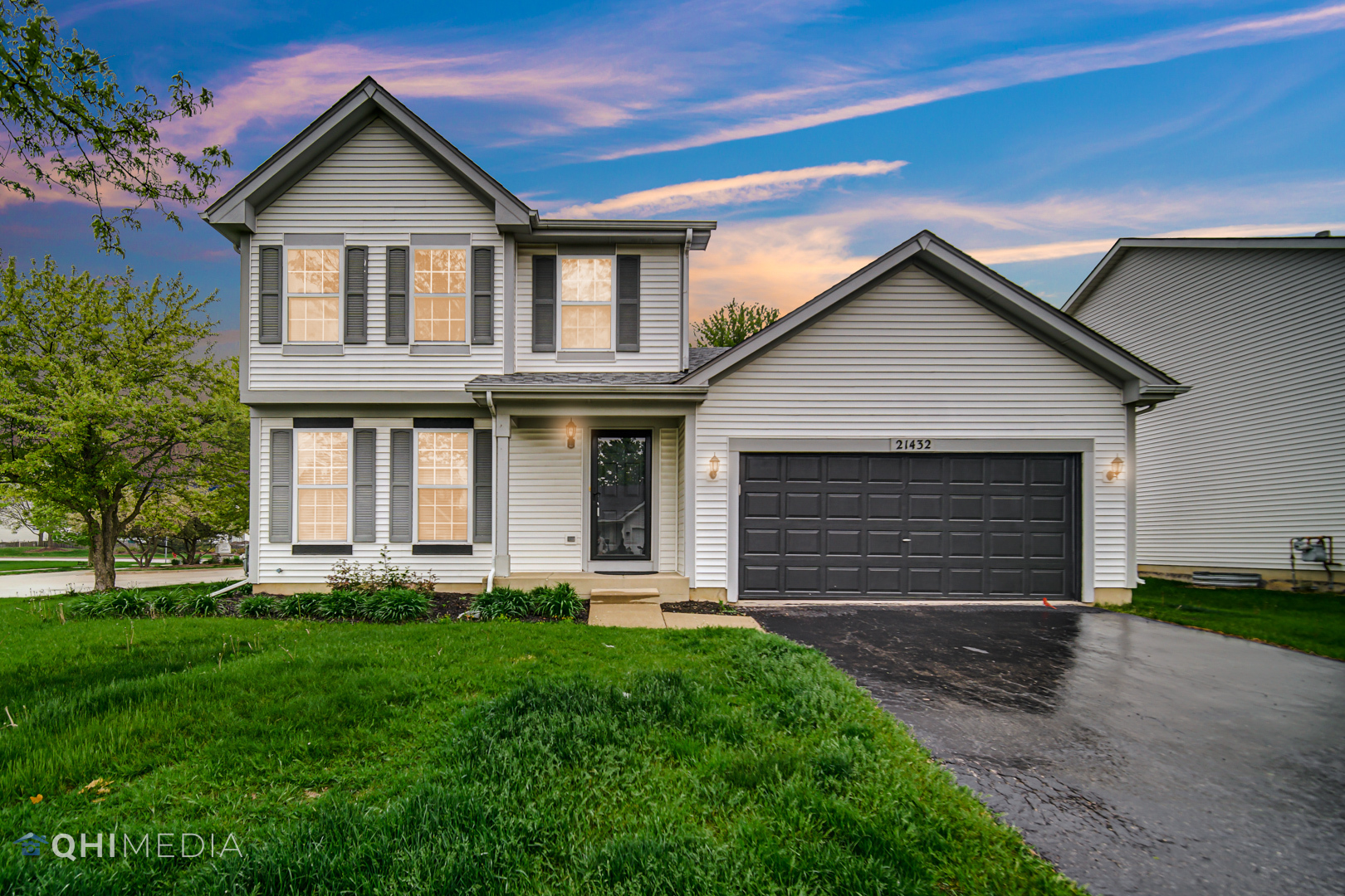 21432 Georgetown Drive Plainfield, IL 60544 - Photo 2 of 24 a front view of a house with a yard and garage