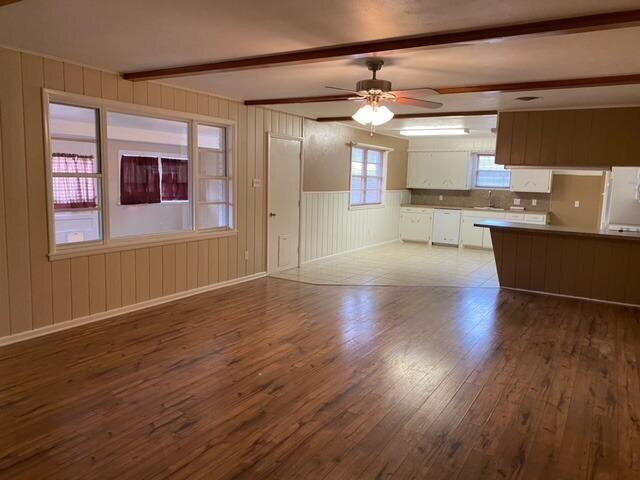 3011 55th Street Lubbock, TX 79413 - Photo 13 of 25 a view of a kitchen with wooden floor and a window