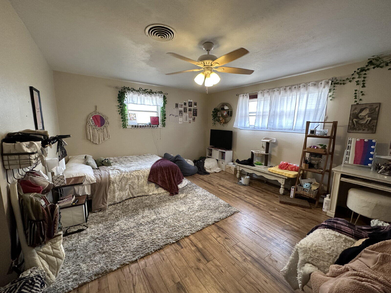 3011 55th Street Lubbock, TX 79413 - Photo 14 of 25 a living room with furniture and a flat screen tv
