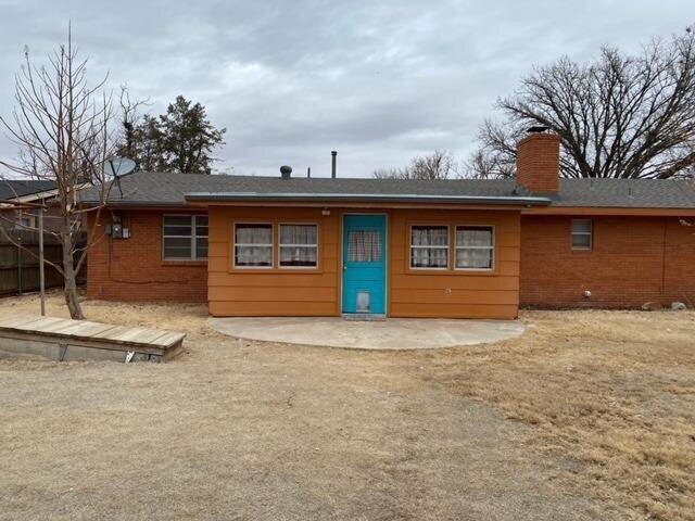 3011 55th Street Lubbock, TX 79413 - Photo 21 of 25 a front view of a house with a yard and garage