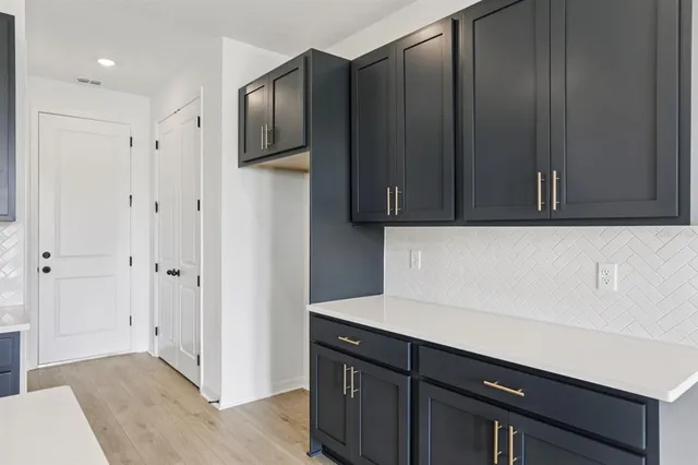 a kitchen with a sink and cabinets