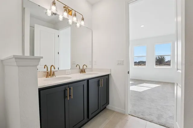 a en suite bathroom with a sink and mirror