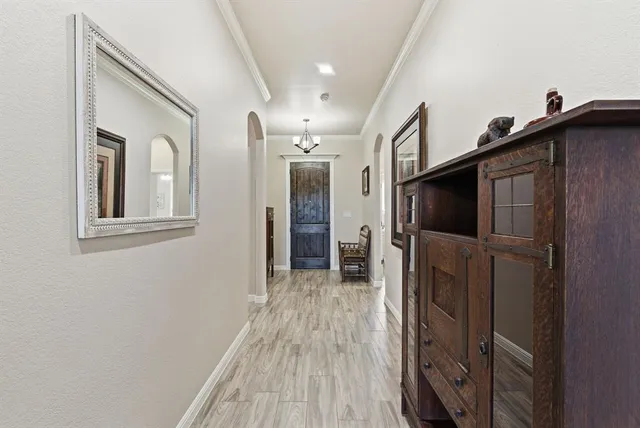 a view of hallway with wooden floor
