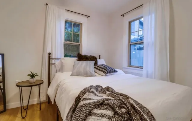 a bedroom with a bed and a table