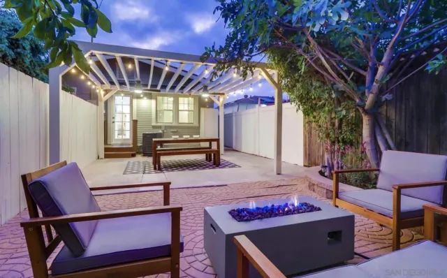 a outdoor space with lots of furniture and umbrella