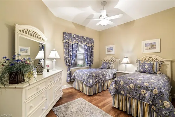 a bedroom with double bed and a large mirror