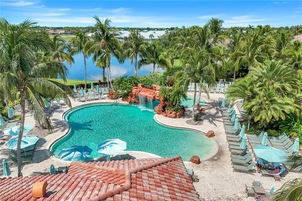 a view of a swimming pool and lounge chair
