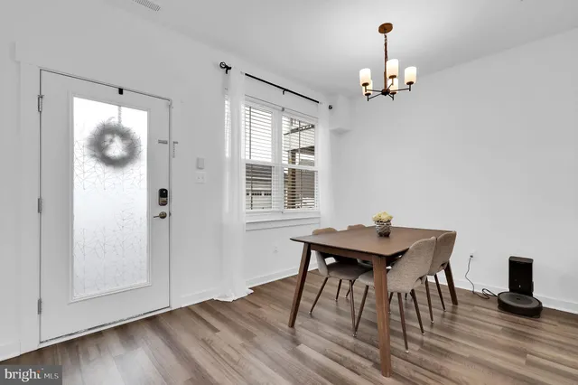 a bathroom with a toilet a sink and a large mirror