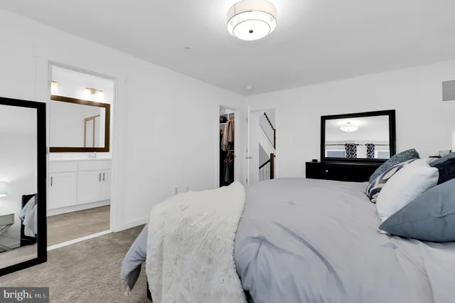 a bathroom with a double vanity sink mirror and