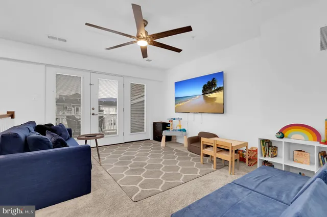 a living room with furniture and a rug