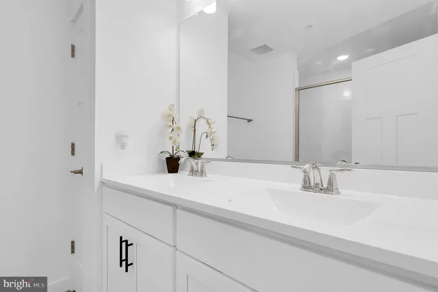 a view of a patio with a table and chairs