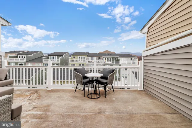 a view of a terrace with furniture and a table
