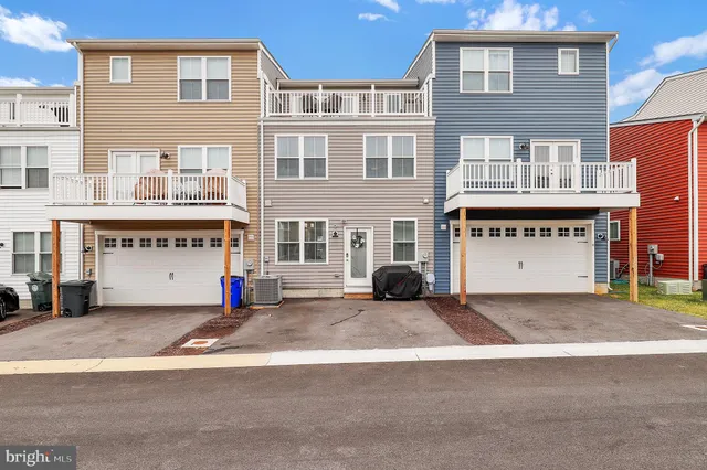 a large building with a swimming pool in front of it