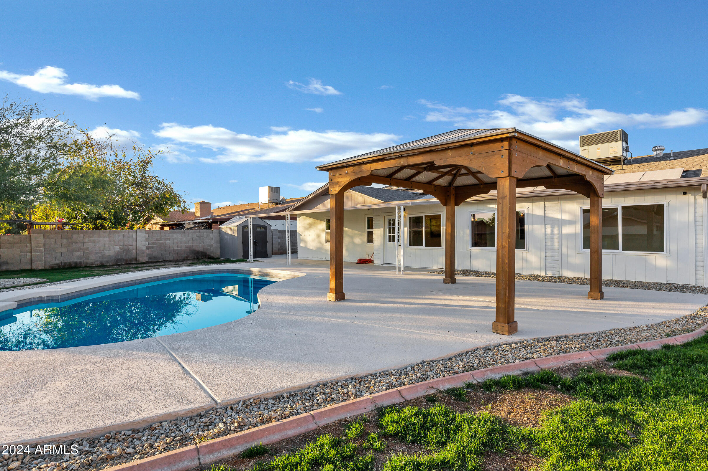 3701 West Phelps Road Phoenix, AZ 85053 - Photo 11 of 46 a front view of a house with garden