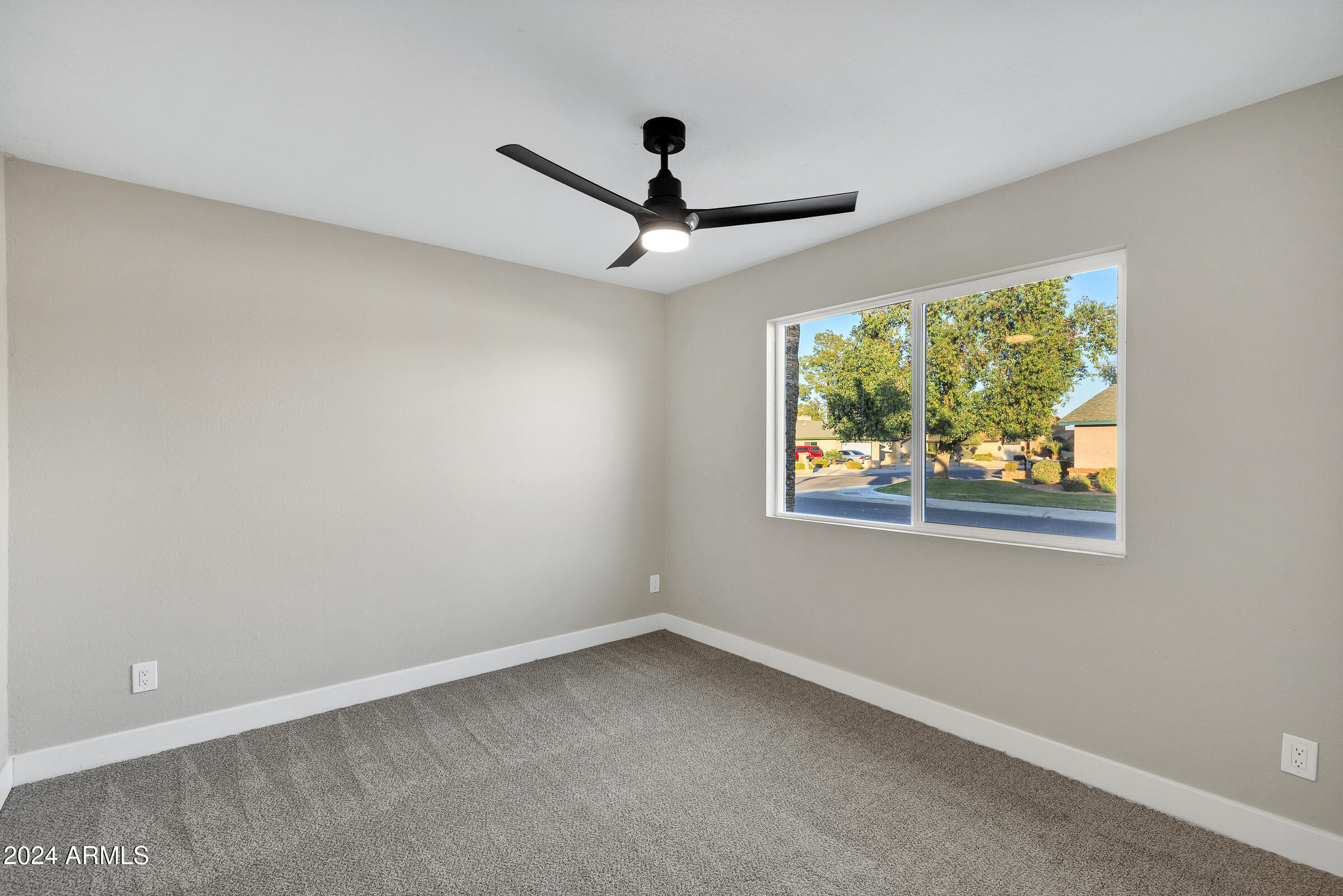 3701 West Phelps Road Phoenix, AZ 85053 - Photo 30 of 46 a view of an empty room with a window
