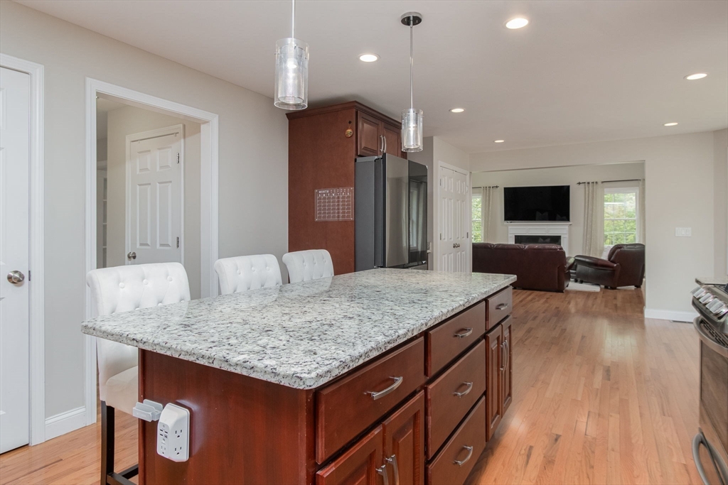 78 Tavern Road Groton, MA 01450 - Photo 12 of 41 a kitchen with center island and living room