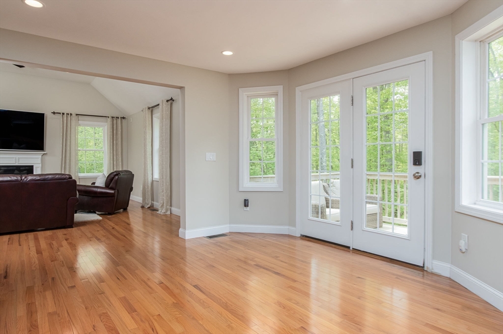 78 Tavern Road Groton, MA 01450 - Photo 15 of 41 a view of a livingroom with a flat screen tv and a window