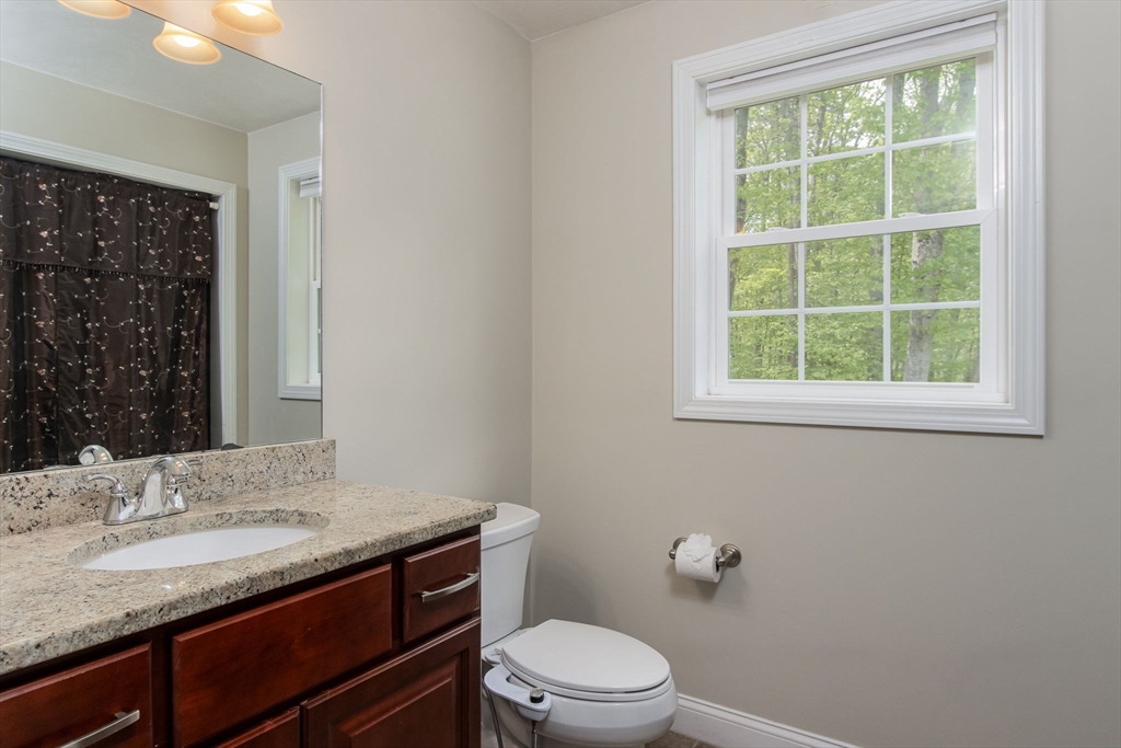 78 Tavern Road Groton, MA 01450 - Photo 16 of 41 a bathroom with a granite countertop sink toilet and shower