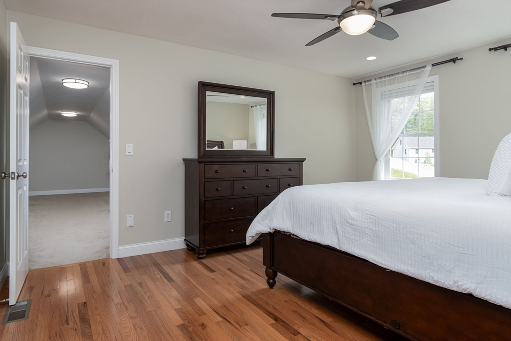 78 Tavern Road Groton, MA 01450 - Photo 18 of 41 a spacious bedroom with a bed and a dresser