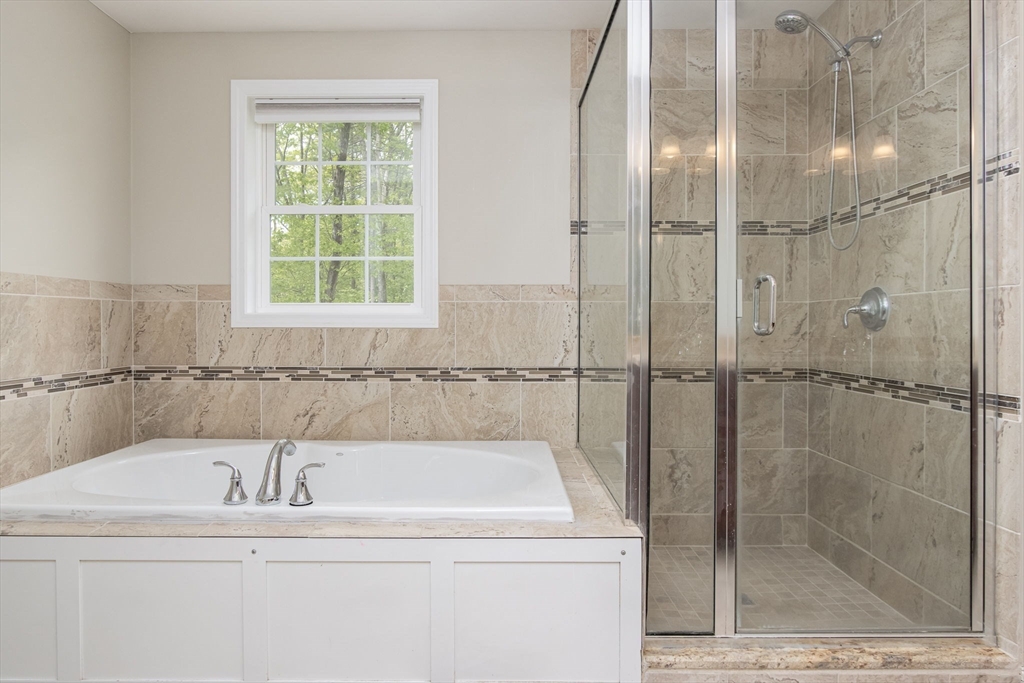 78 Tavern Road Groton, MA 01450 - Photo 21 of 41 a bathroom with a bathtub and a shower