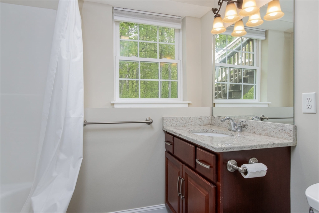 78 Tavern Road Groton, MA 01450 - Photo 29 of 41 a bathroom with a granite countertop sink and a window