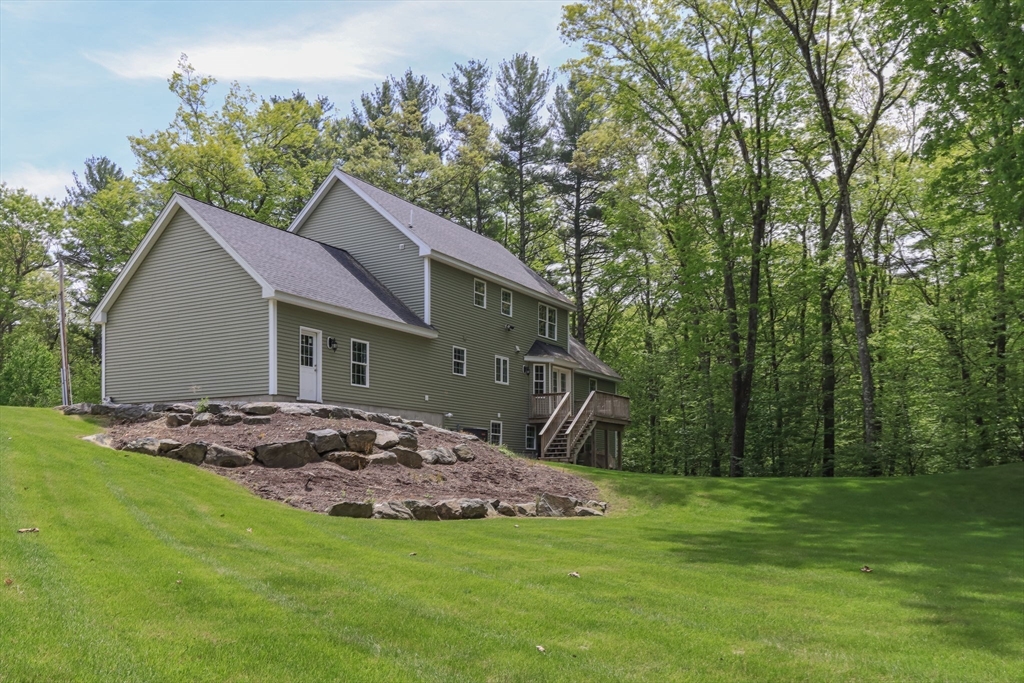 78 Tavern Road Groton, MA 01450 - Photo 33 of 41 a view of a house with a backyard