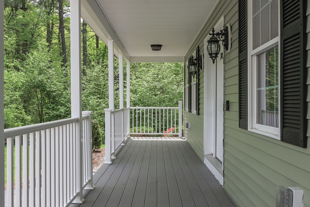 78 Tavern Road Groton, MA 01450 - Photo 4 of 41 a view of a balcony with wooden floor