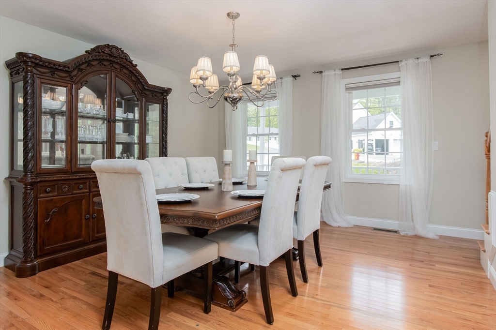 78 Tavern Road Groton, MA 01450 - Photo 10 of 41 a dining room filled chandelier and wooden floor