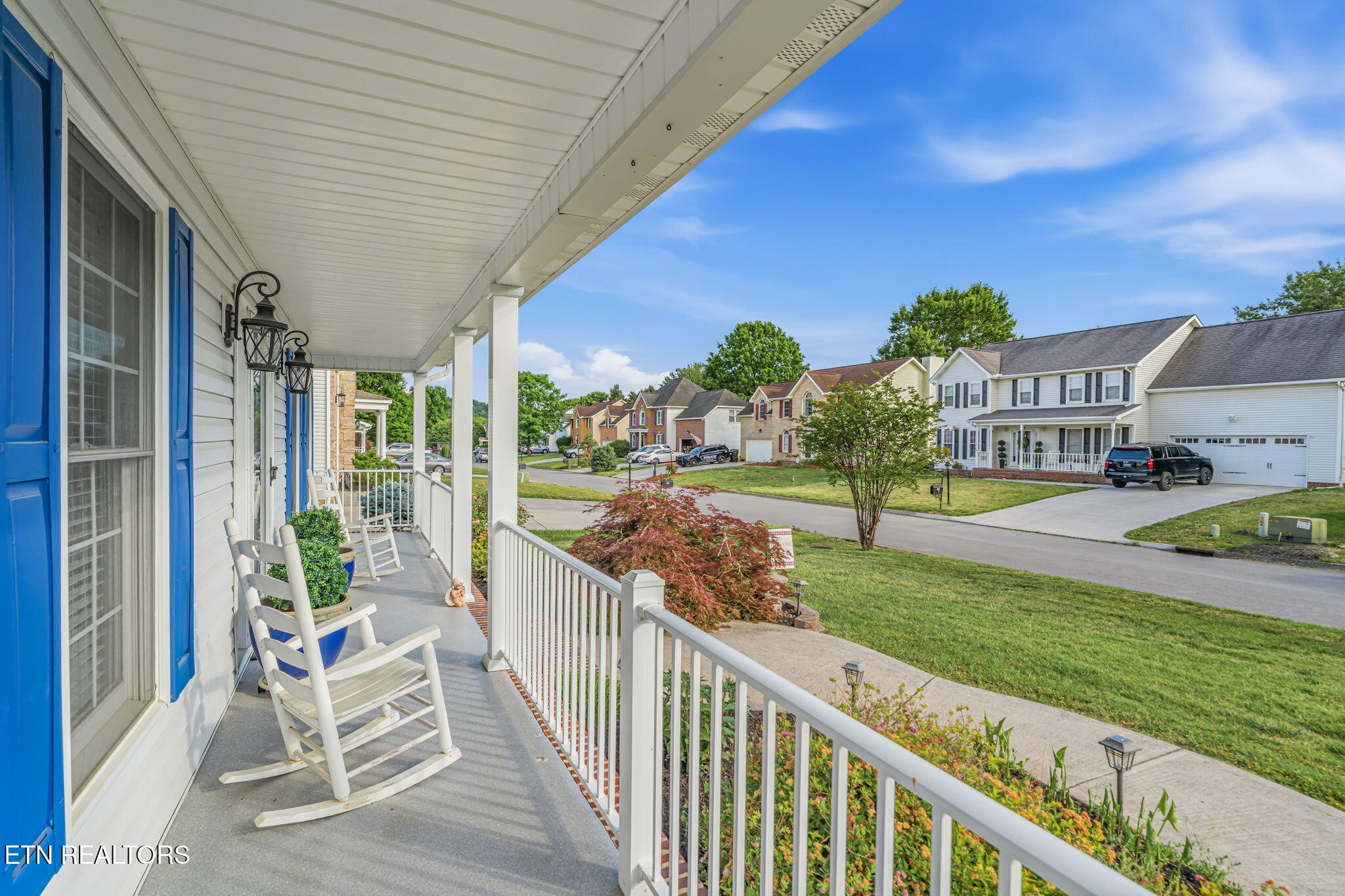 7030 Westerly Winds Road Knoxville, TN 37931 - Photo 8 of 40 a view of a porch with furniture and garden