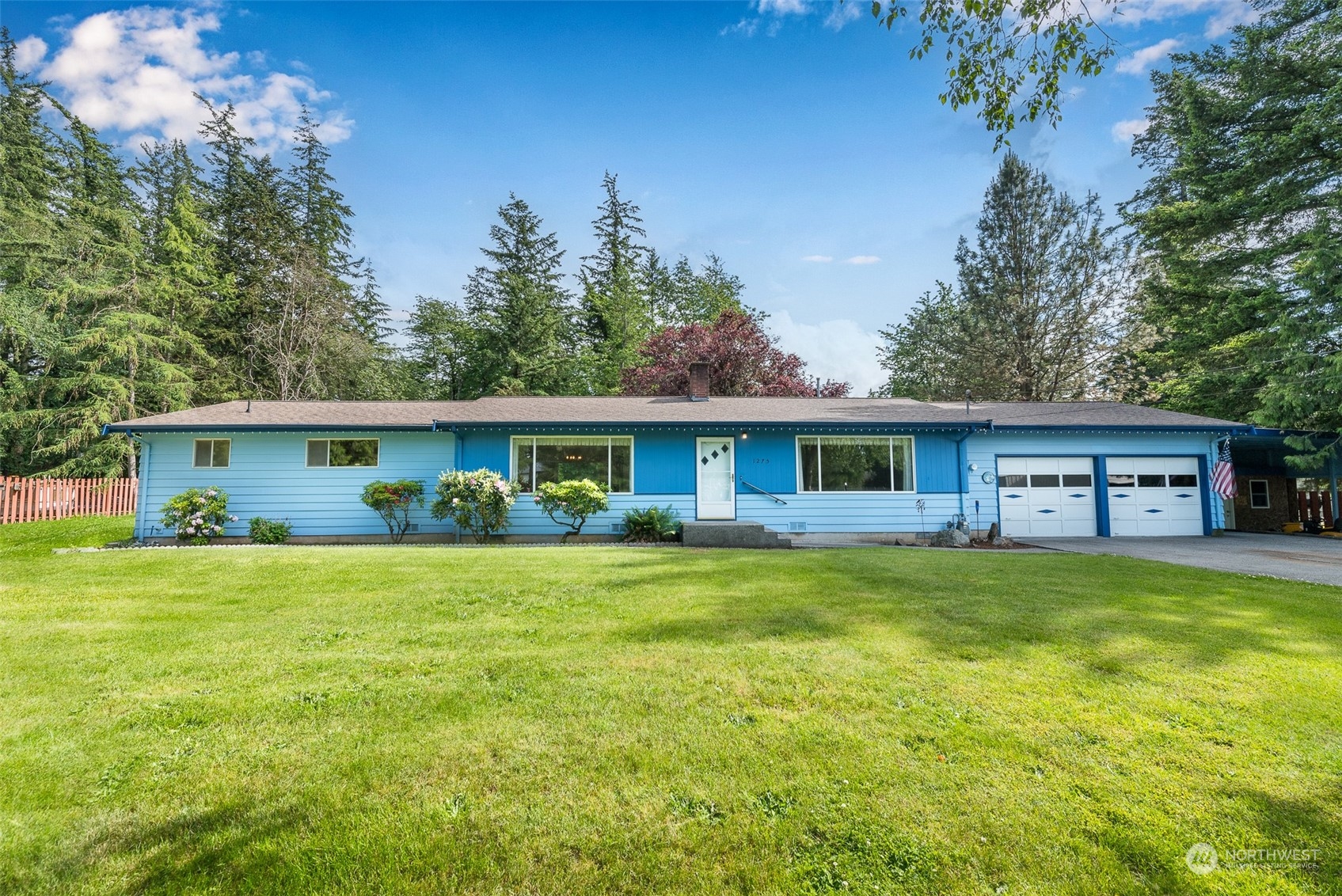 1275 West Axton Road Ferndale, WA 98248 - Photo 1 of 30 a front view of a house with a garden