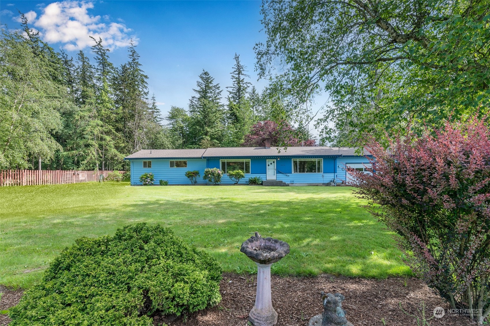 1275 West Axton Road Ferndale, WA 98248 - Photo 19 of 30 a front view of a house with garden