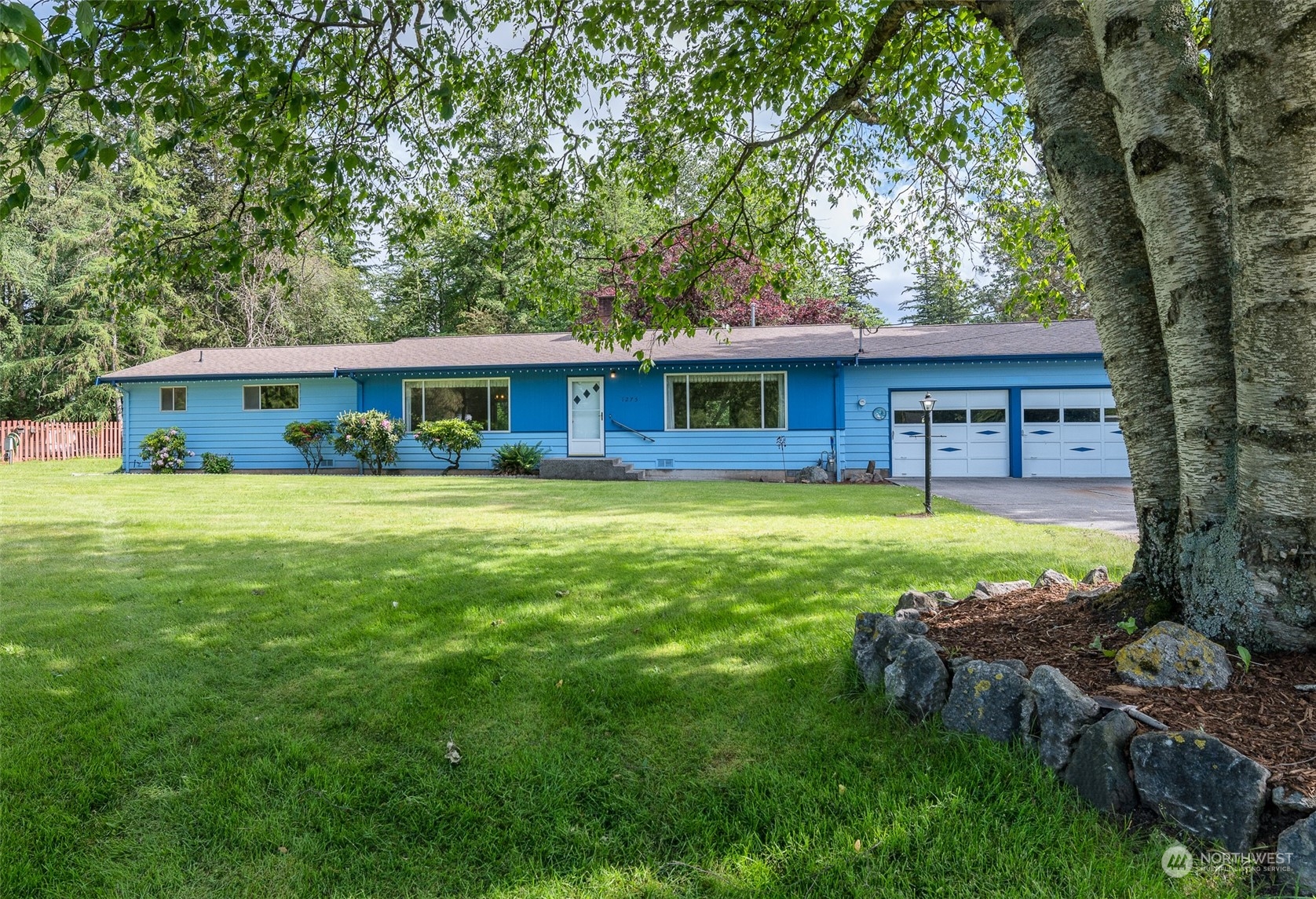 1275 West Axton Road Ferndale, WA 98248 - Photo 20 of 30 a view of a house with a yard deck and sitting area
