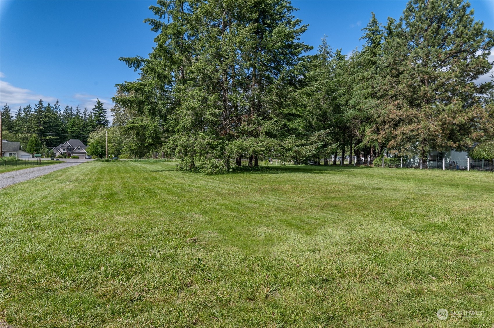 1275 West Axton Road Ferndale, WA 98248 - Photo 21 of 30 a view of a grassy field with trees