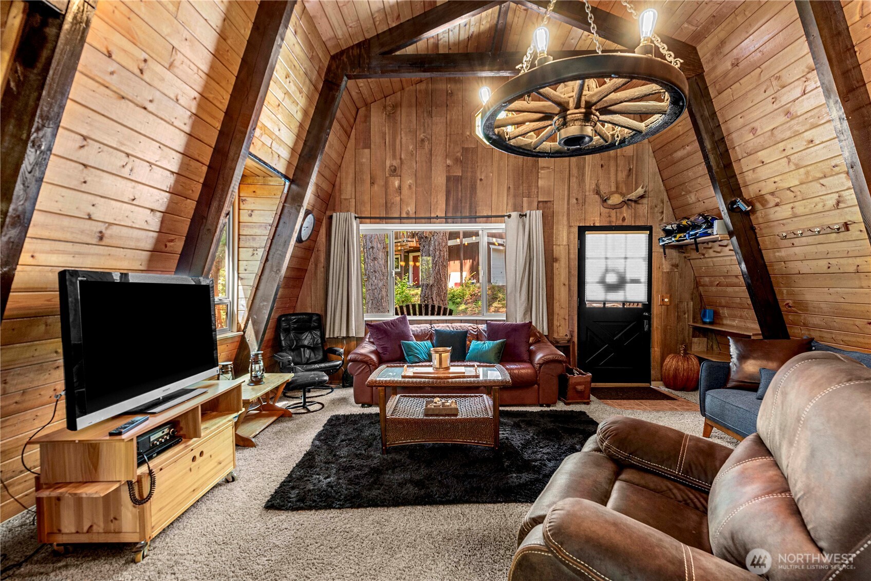 20 Deer Point Lane Ronald, WA 98940 - Photo 9 of 28 a living room with furniture a large window and a flat screen tv