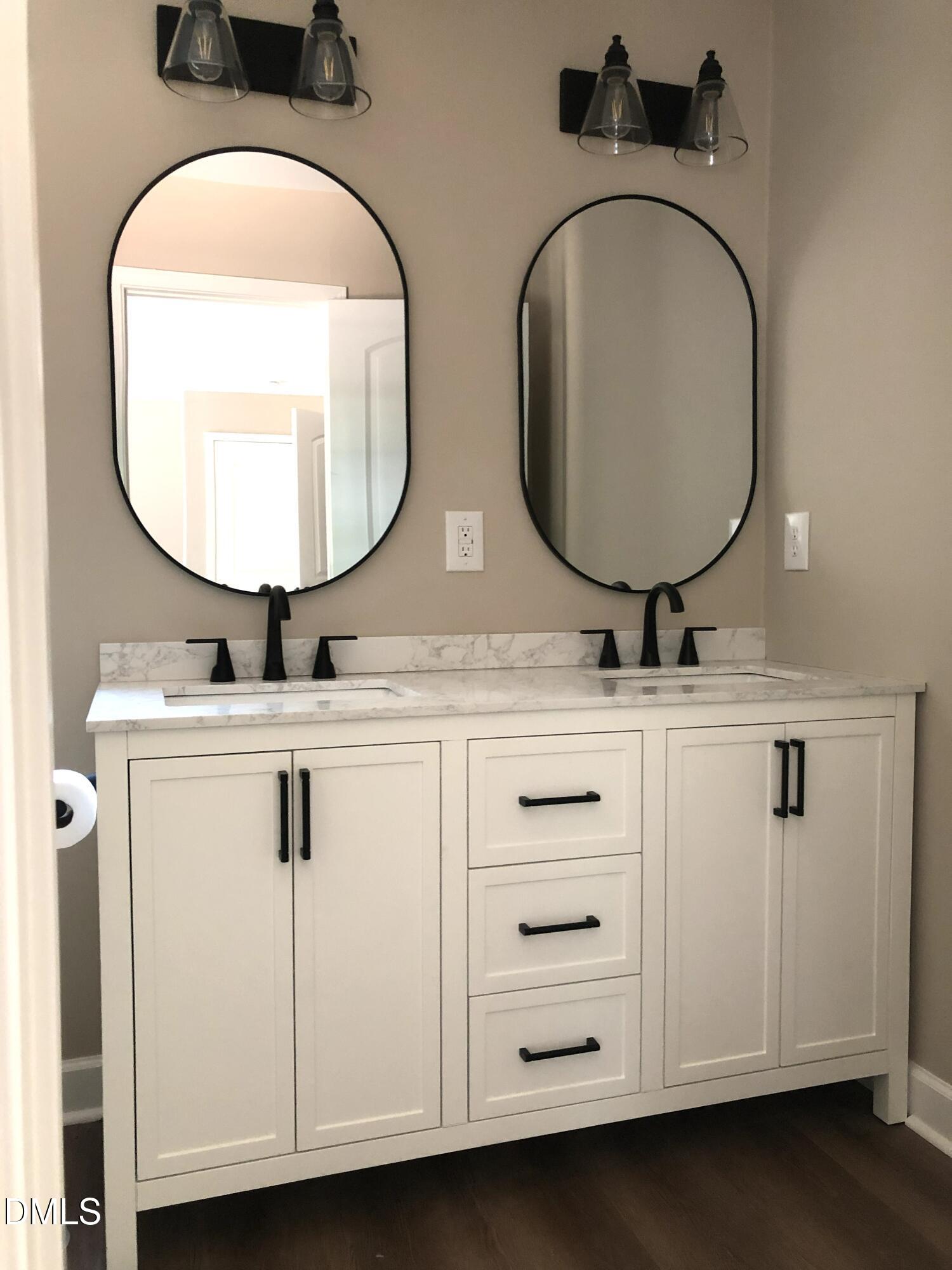95 Smith Taylor Trail Roxboro, NC 27574 - Photo 6 of 47 a bathroom with 2 sink and a mirror