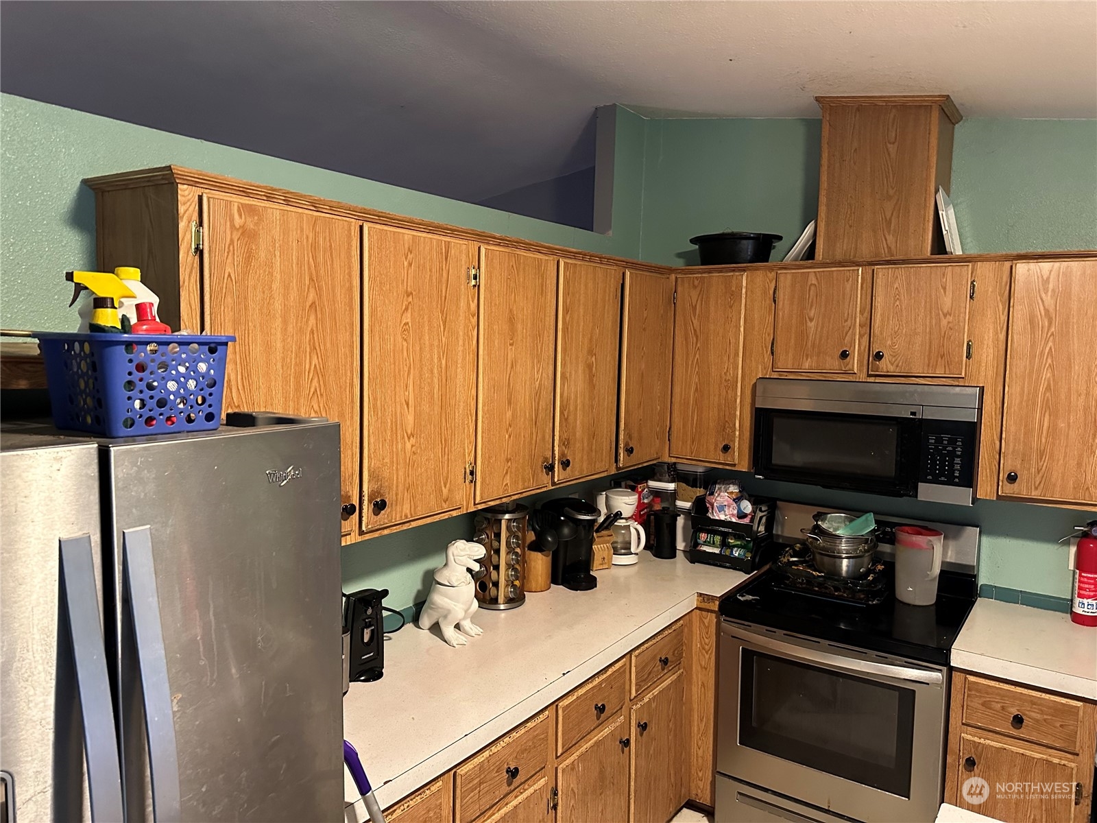 8403 176th Avenue Southwest Rochester, WA 98579 - Photo 6 of 14 a kitchen with stainless steel appliances a stove a refrigerator and a sink