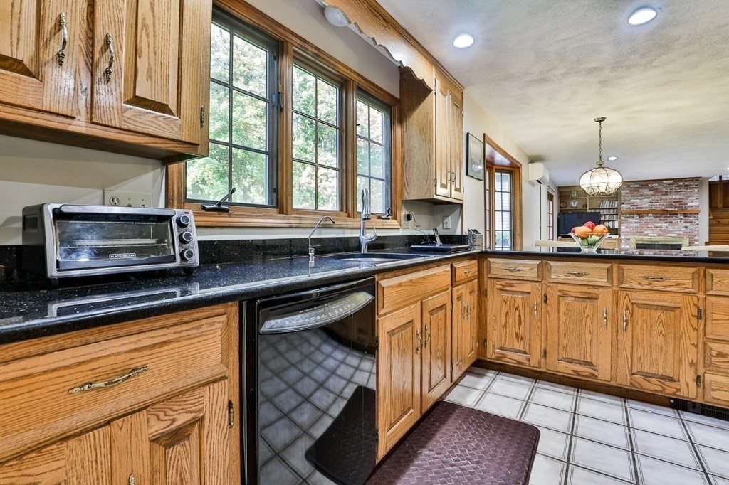 18 Forest Lane Boxford, MA 01921 - Photo 15 of 33 a kitchen with stainless steel appliances granite countertop a sink and cabinets