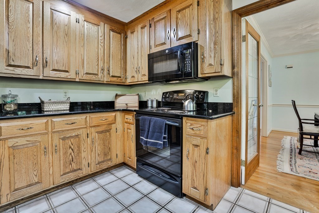 18 Forest Lane Boxford, MA 01921 - Photo 16 of 33 a kitchen with stainless steel appliances granite countertop a stove a sink and a refrigerator