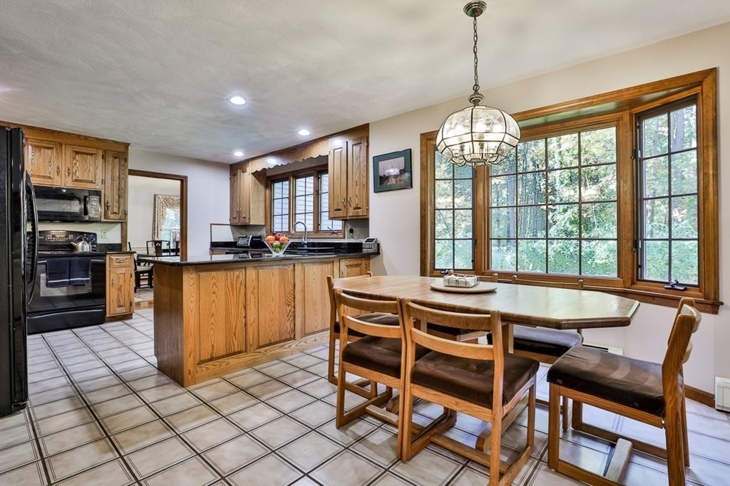18 Forest Lane Boxford, MA 01921 - Photo 18 of 33 a dining table chair and appliances in a room