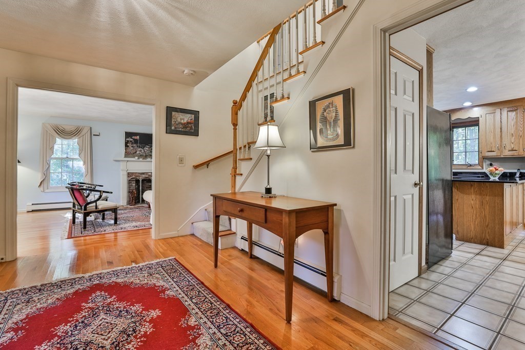 18 Forest Lane Boxford, MA 01921 - Photo 20 of 33 a living room with furniture rug and a dining table